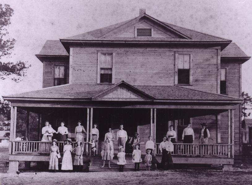 Haynie and Wood families, and some neighbors, in front of "the Haynie hotel" in Richards, about 1911.