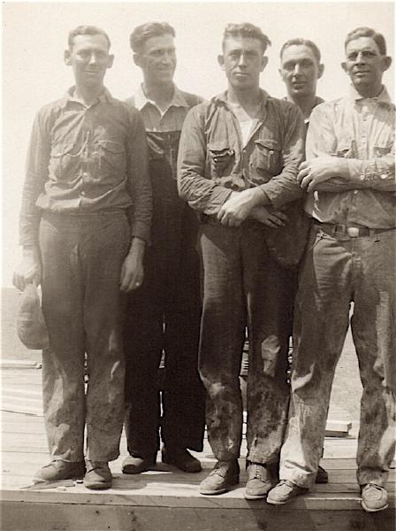 Ross Ward, center, pictured with four co-workers.